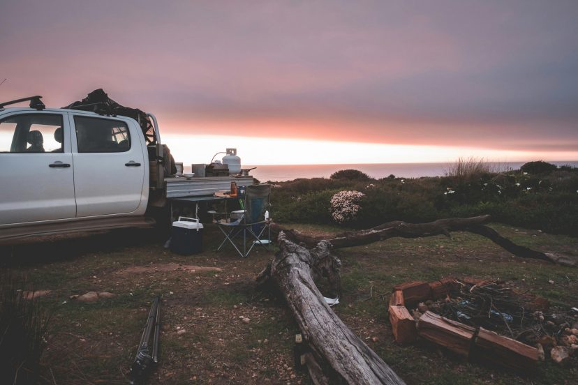 A campsite with a truck camping setup