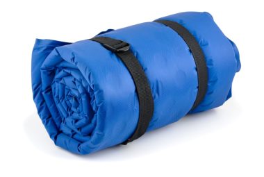 Rolled blue inflatable camping bed roll isolated on white