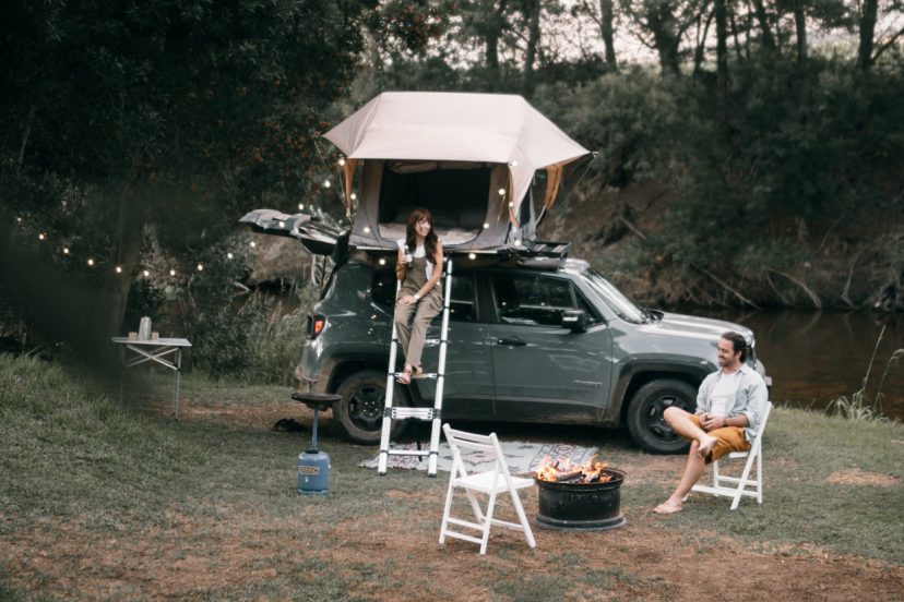 camper tent on suv at campsite