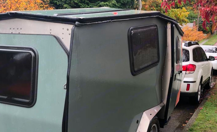 Cricket Camper towed by a small SUV