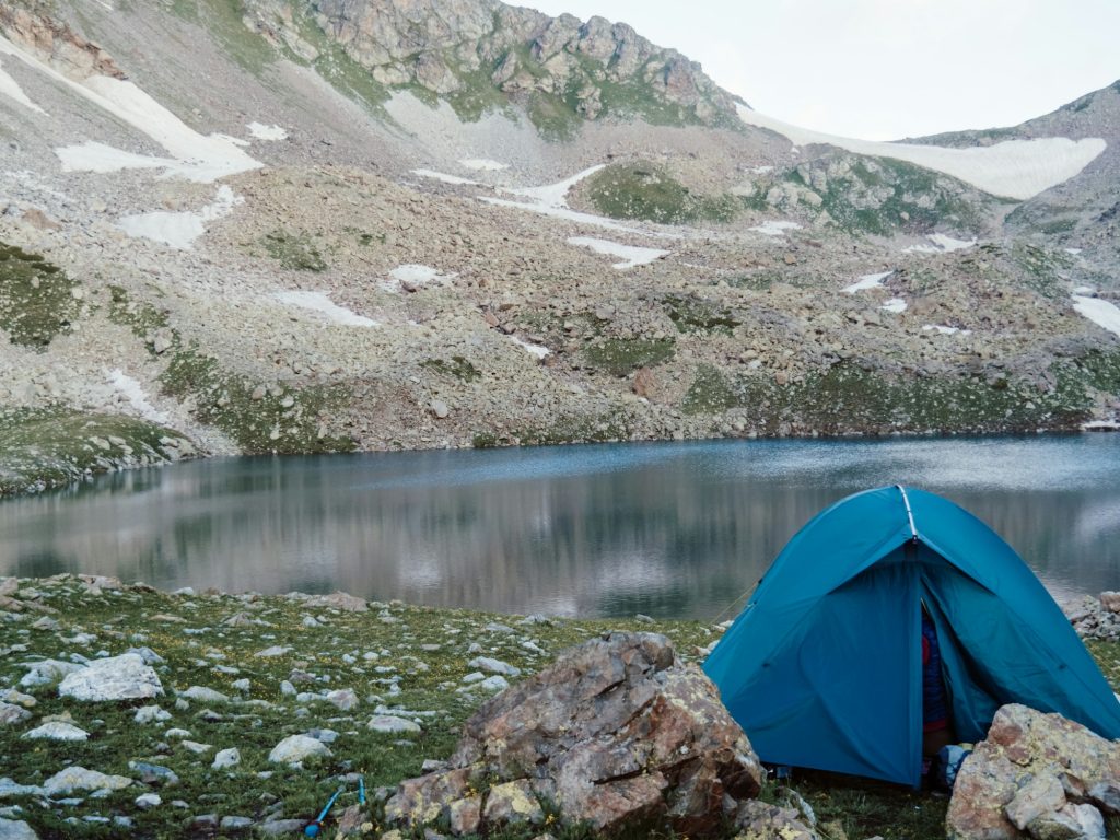 Camping tent with lake background.