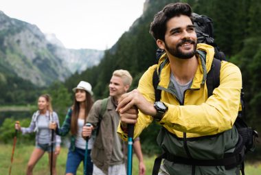 Group of friends on a hiking, camping trip in the mountains
